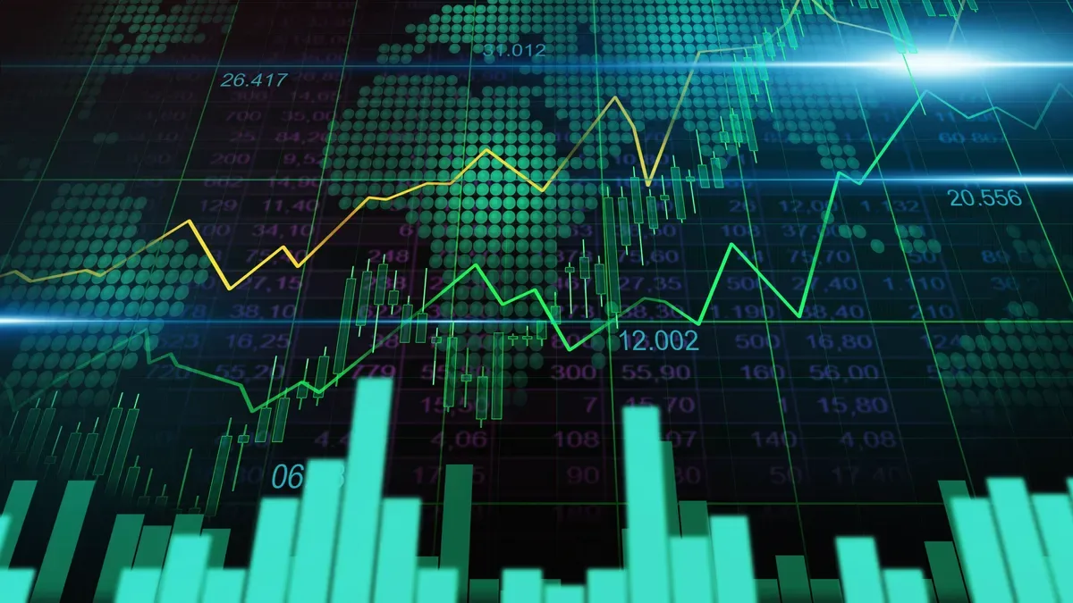 Índices bursátiles asiáticos y español Ibex 35 en pantallas de trading con gráficos alcistas